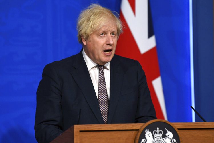 Johnson says restrictions to ease, UK must live with virus